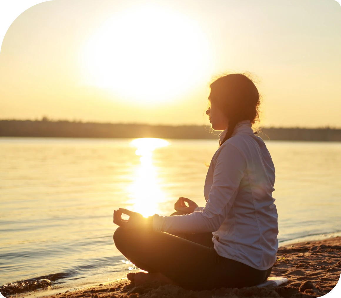 Serene meditation during sunset by water