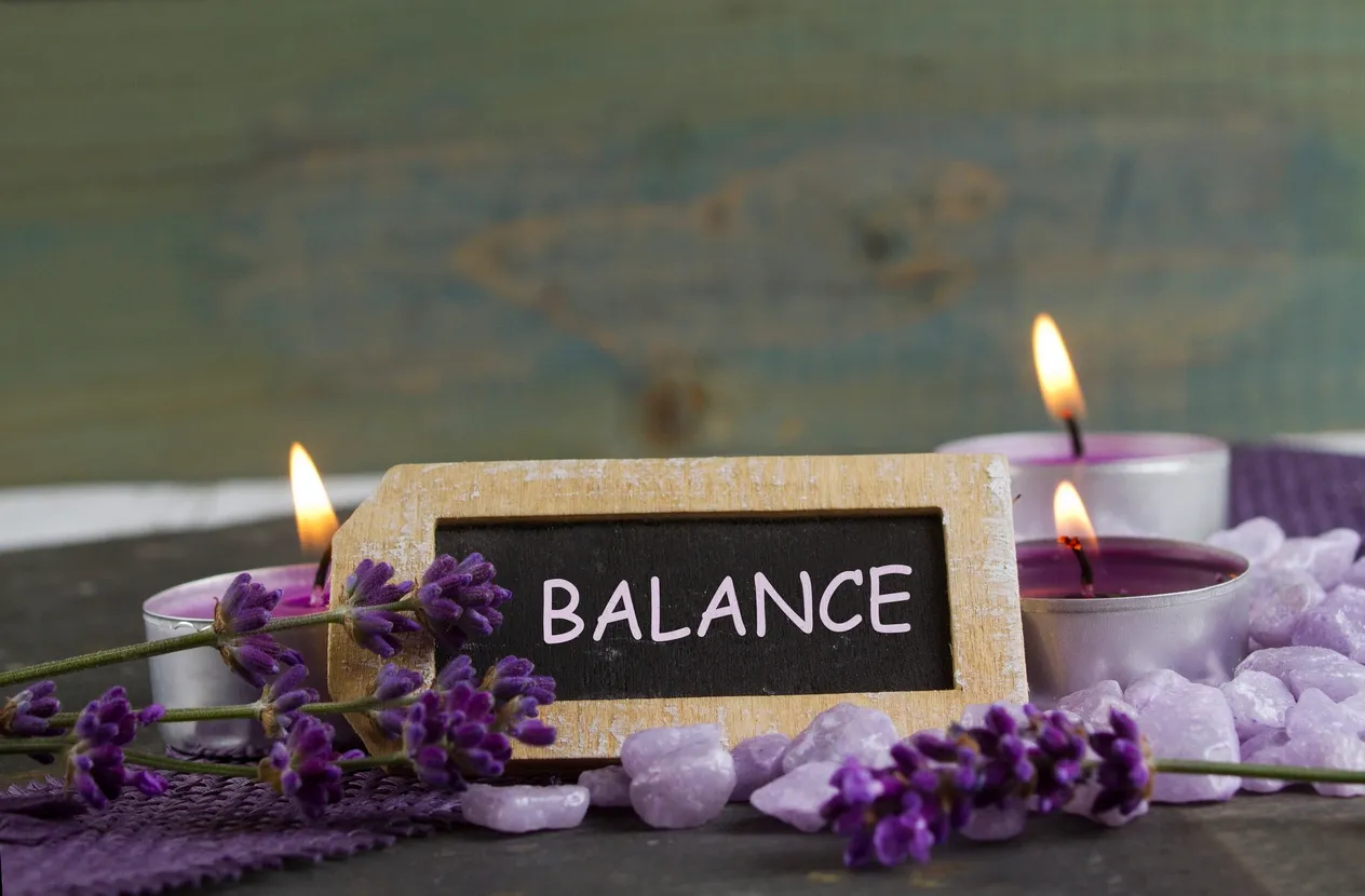 Balance sign with candles and lavender