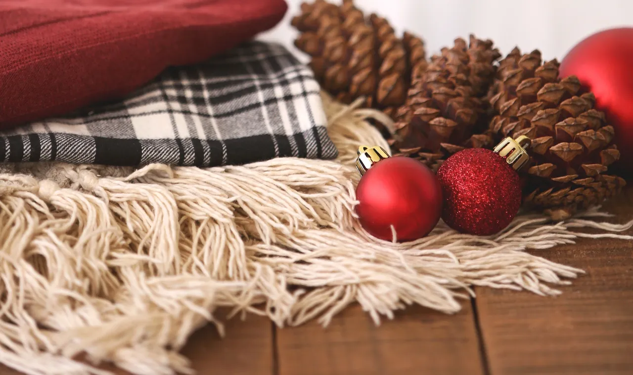 Festive scene with red ornaments and blanket