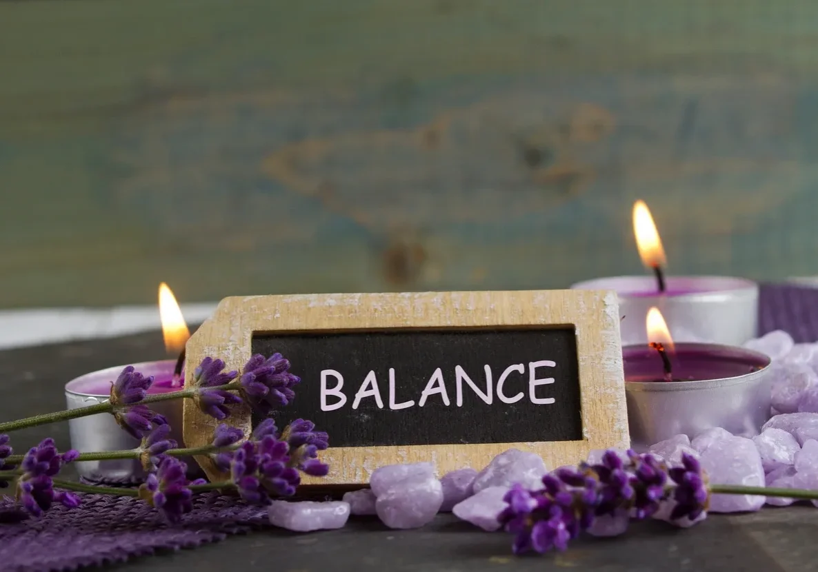 Balance sign with candles and lavender