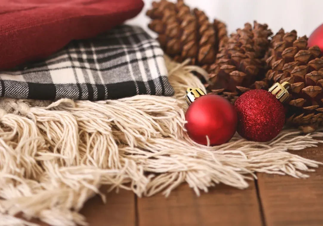 Festive scene with red ornaments and blanket